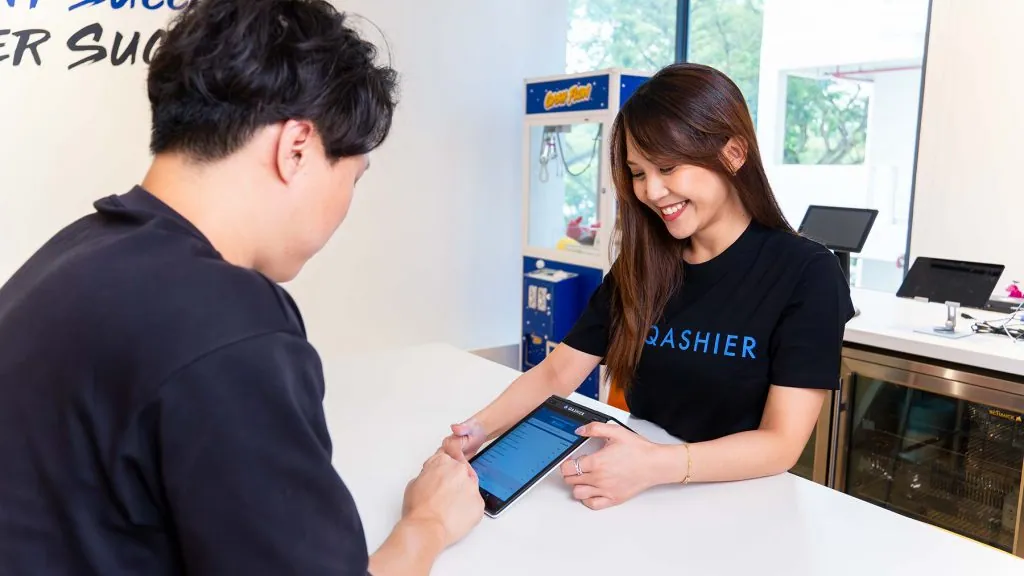 Staff using QashierX2 terminal