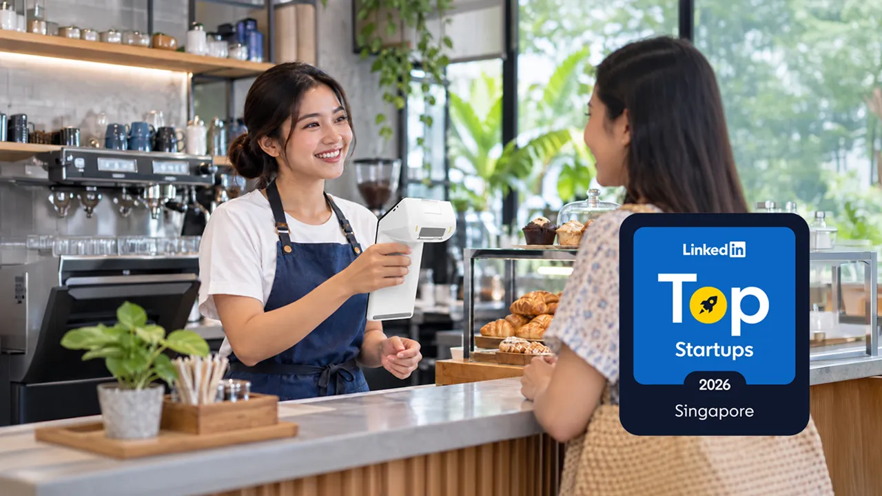 LinkedIn Top Startups 2026 Singapore badge beside a Qashier terminal at a café counter